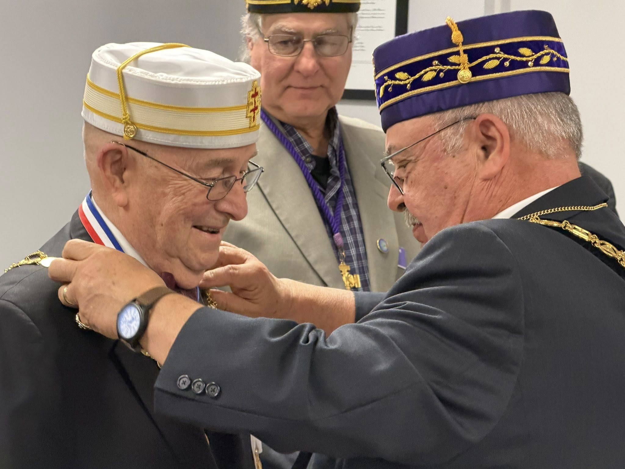 A Brother receiving his Scottish Rite cap during an investiture ceremony